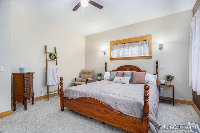 bedroom with ceiling fan and light colored carpet