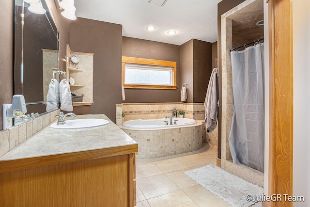 bathroom featuring tile patterned floors, vanity, and independent shower and bath