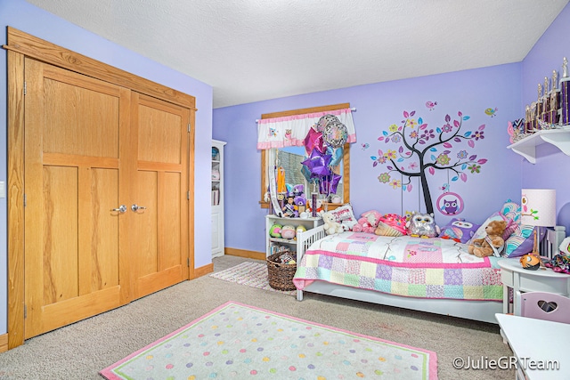 carpeted bedroom with a textured ceiling