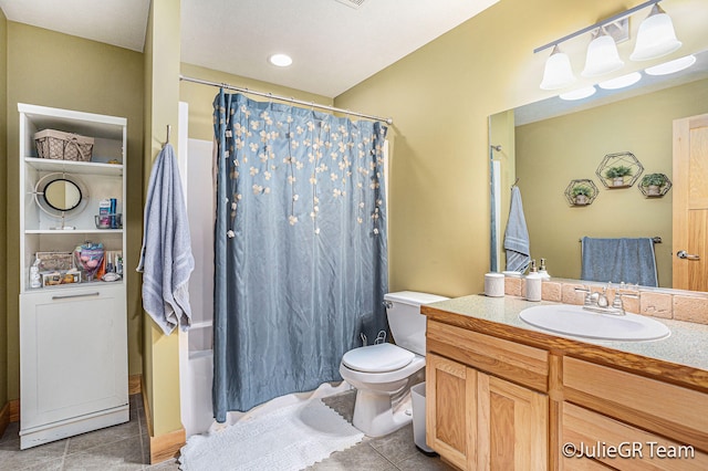 bathroom with tile patterned floors, vanity, and toilet