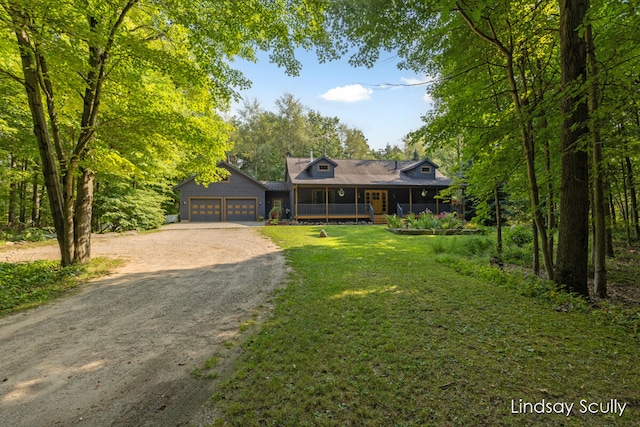 view of front of home featuring a garage, a porch, and a front yard