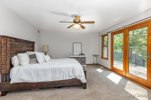 bedroom featuring access to exterior, ceiling fan, and carpet