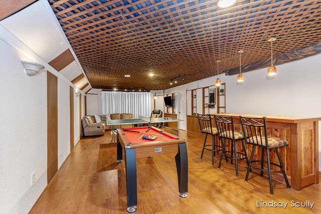 rec room with indoor bar, light hardwood / wood-style floors, and billiards