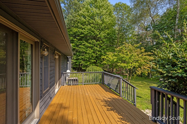 wooden deck with a yard