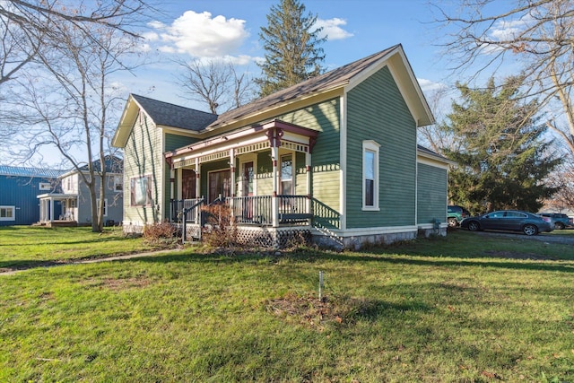 view of front of house featuring covered porch and a front lawn