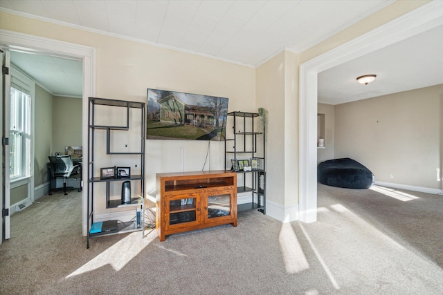 living room with carpet floors and ornamental molding