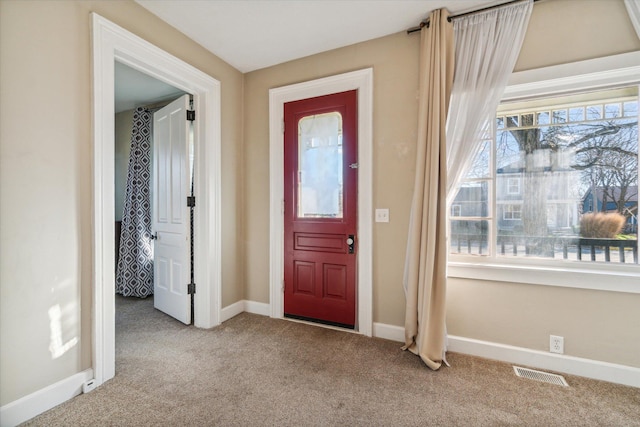 view of carpeted foyer