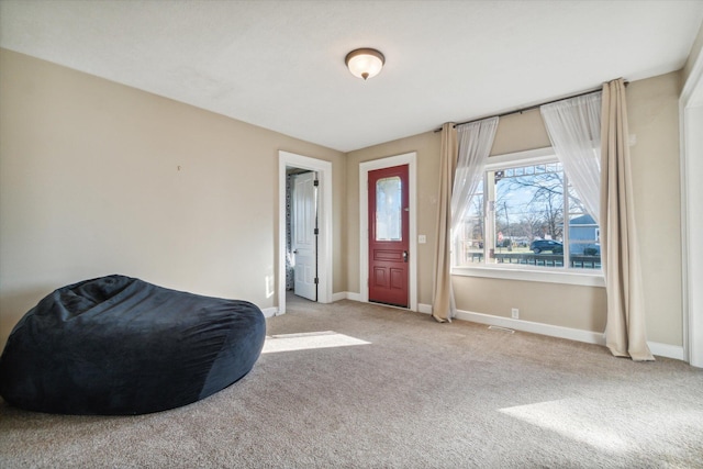 entryway with light colored carpet