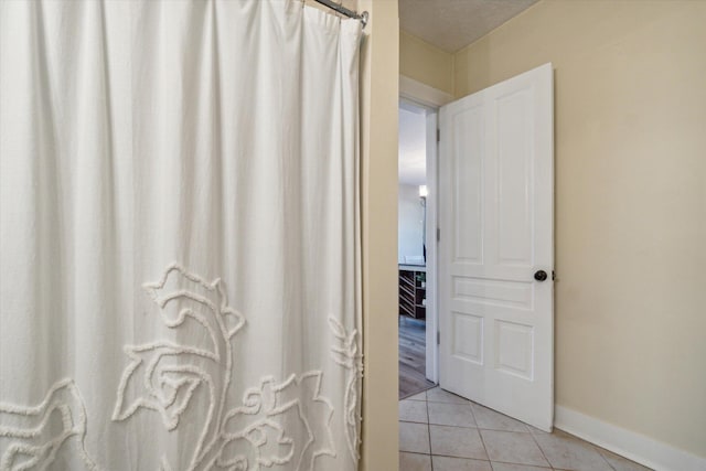 bathroom with tile patterned floors