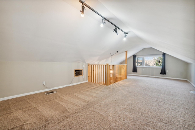 bonus room with carpet flooring, a wall mounted air conditioner, and vaulted ceiling