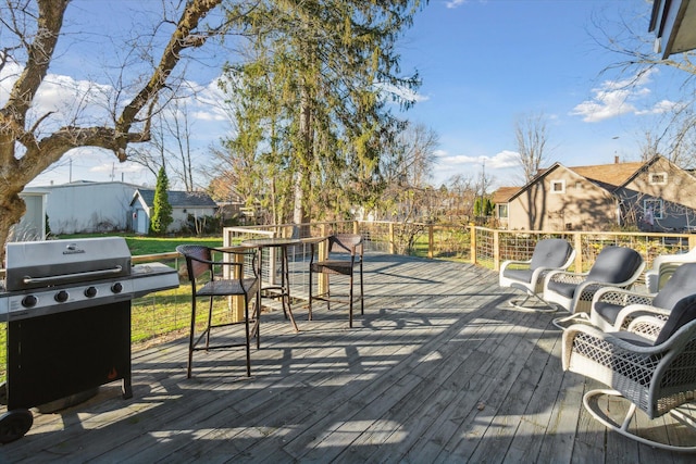 wooden terrace with area for grilling