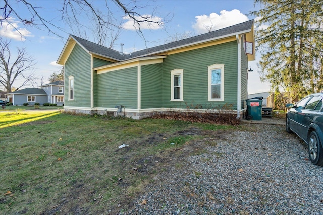 view of home's exterior featuring a yard