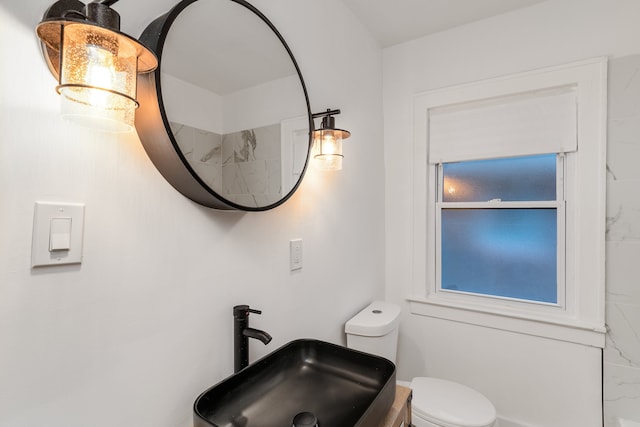 bathroom featuring sink and toilet