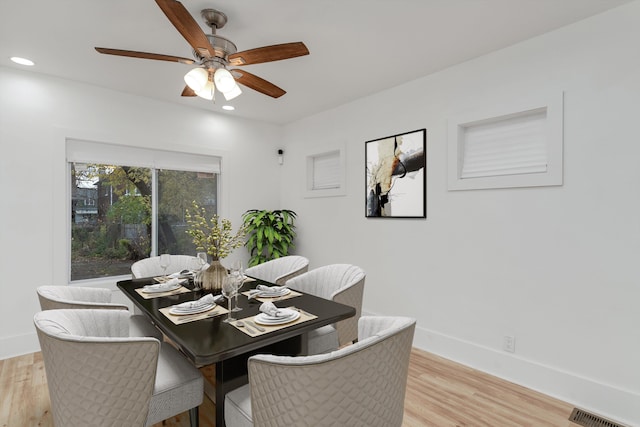 dining area featuring light hardwood / wood-style flooring and ceiling fan