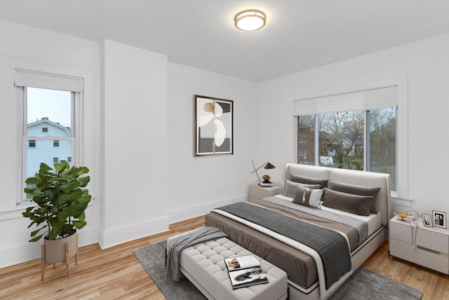 bedroom with light hardwood / wood-style flooring