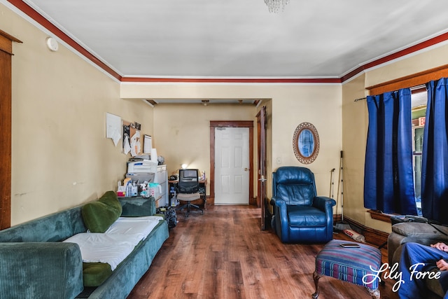 living room featuring dark hardwood / wood-style floors and crown molding