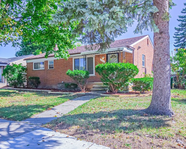 view of front of home with a front lawn