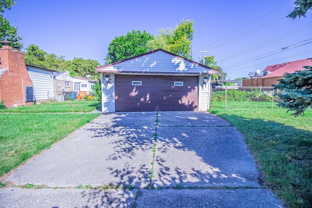 garage featuring a lawn