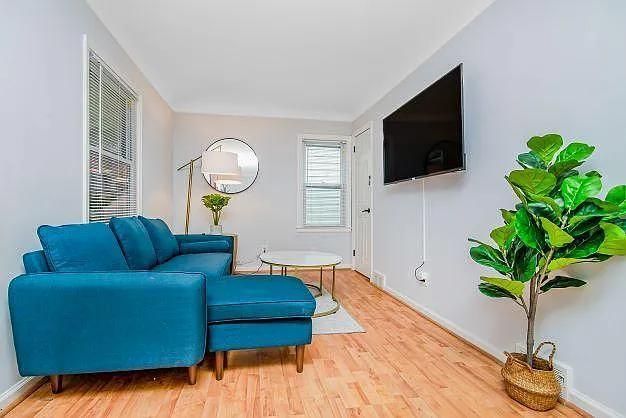 sitting room featuring wood-type flooring