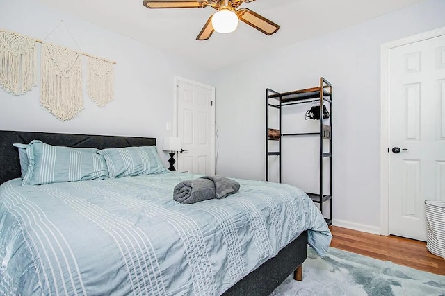 bedroom featuring hardwood / wood-style flooring and ceiling fan