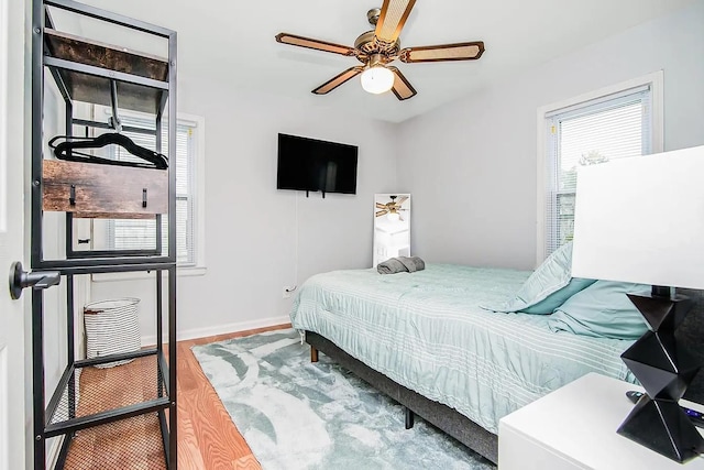 bedroom featuring ceiling fan and wood-type flooring