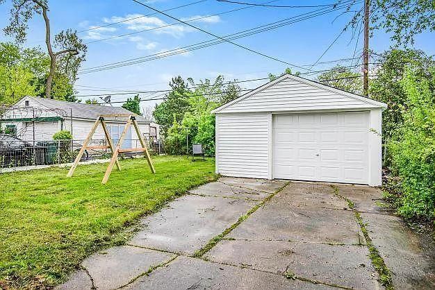 garage with a lawn