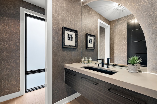 bathroom featuring vanity and hardwood / wood-style flooring