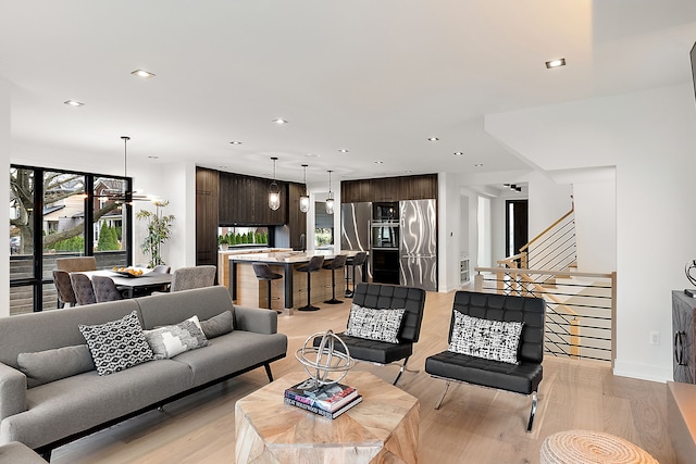 living room with light hardwood / wood-style flooring