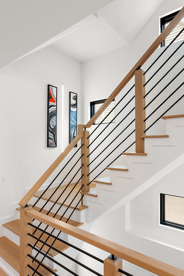 stairway with hardwood / wood-style floors