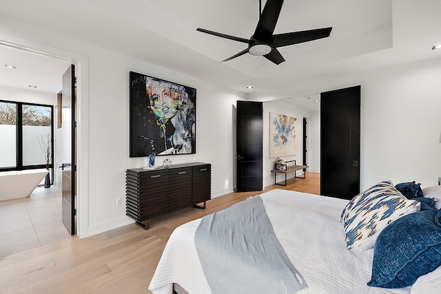 bedroom featuring ceiling fan and light hardwood / wood-style floors