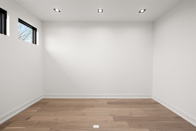 unfurnished room with light hardwood / wood-style floors