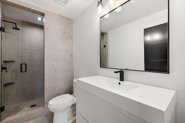 bathroom with vanity, toilet, and walk in shower