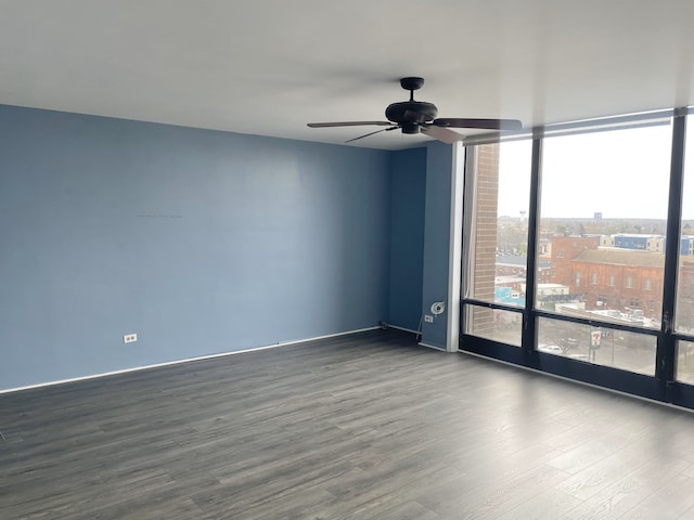 unfurnished room featuring ceiling fan and wood-type flooring