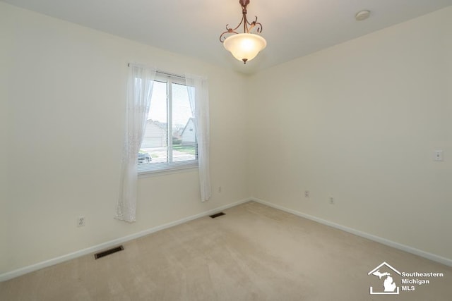 empty room featuring carpet flooring