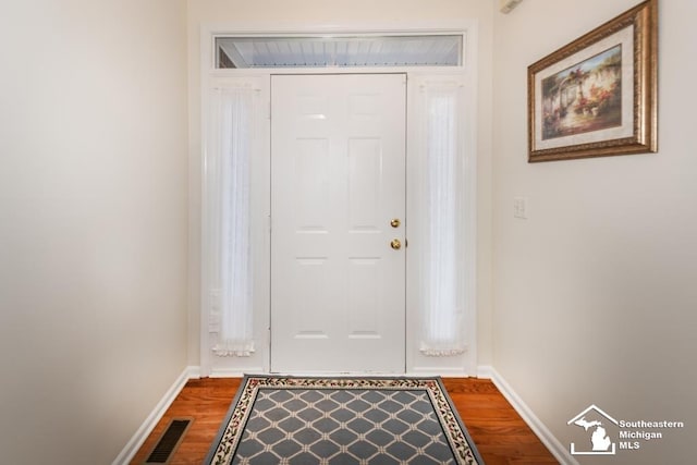 entryway with hardwood / wood-style flooring