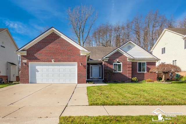 view of front of property featuring a front lawn and a garage