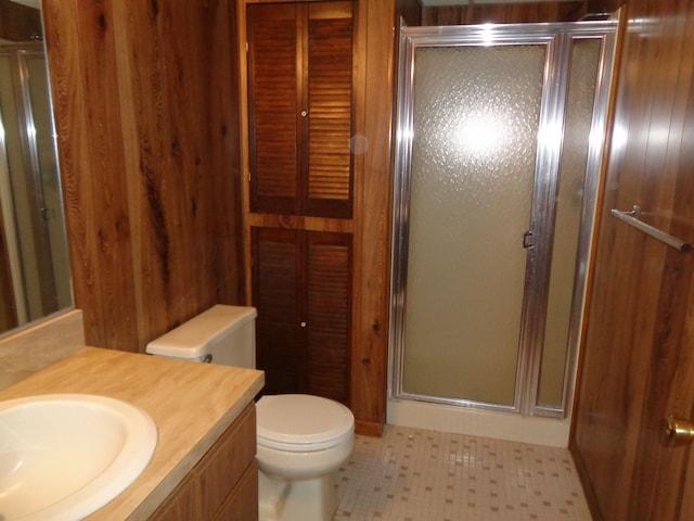 bathroom with vanity, toilet, and walk in shower