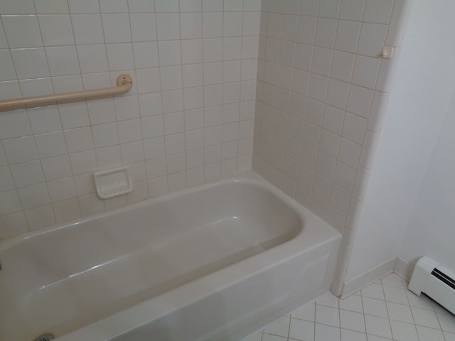 bathroom with tile patterned floors and baseboard heating