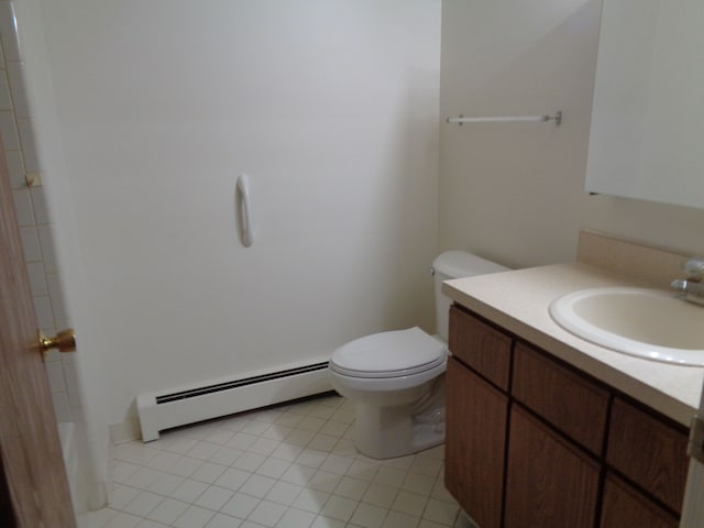 bathroom featuring tile patterned flooring, vanity, toilet, and baseboard heating