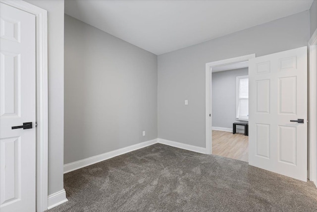 unfurnished room with carpet floors