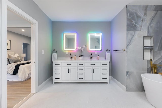 bathroom featuring vanity and a bathtub