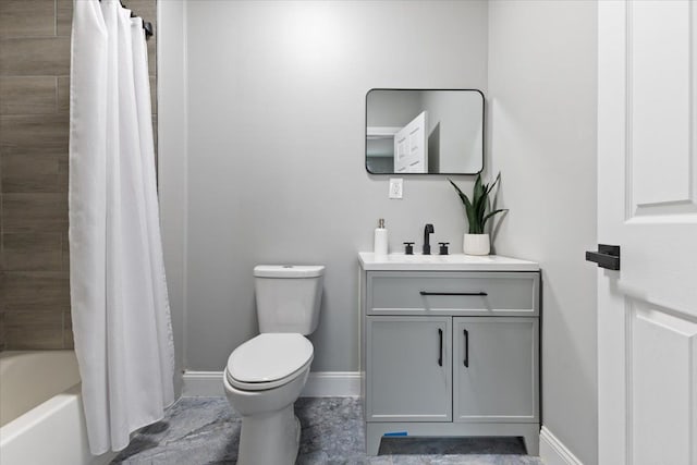 full bathroom featuring vanity, shower / tub combo, and toilet