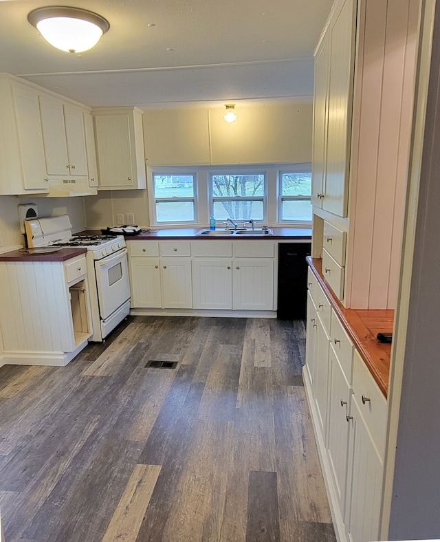 kitchen with white gas range oven, sink, dishwasher, dark hardwood / wood-style floors, and white cabinetry