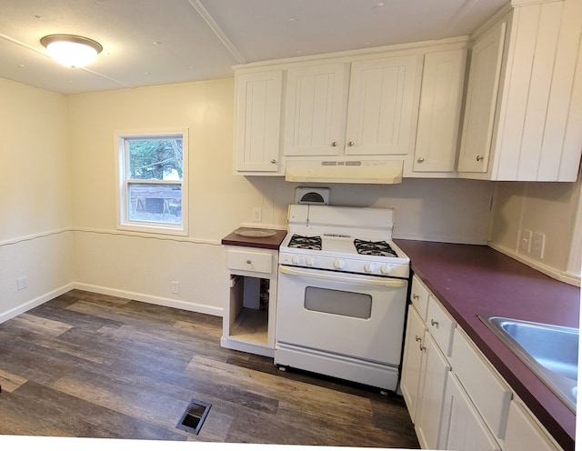 kitchen with dark hardwood / wood-style floors, white cabinetry, gas range gas stove, and exhaust hood