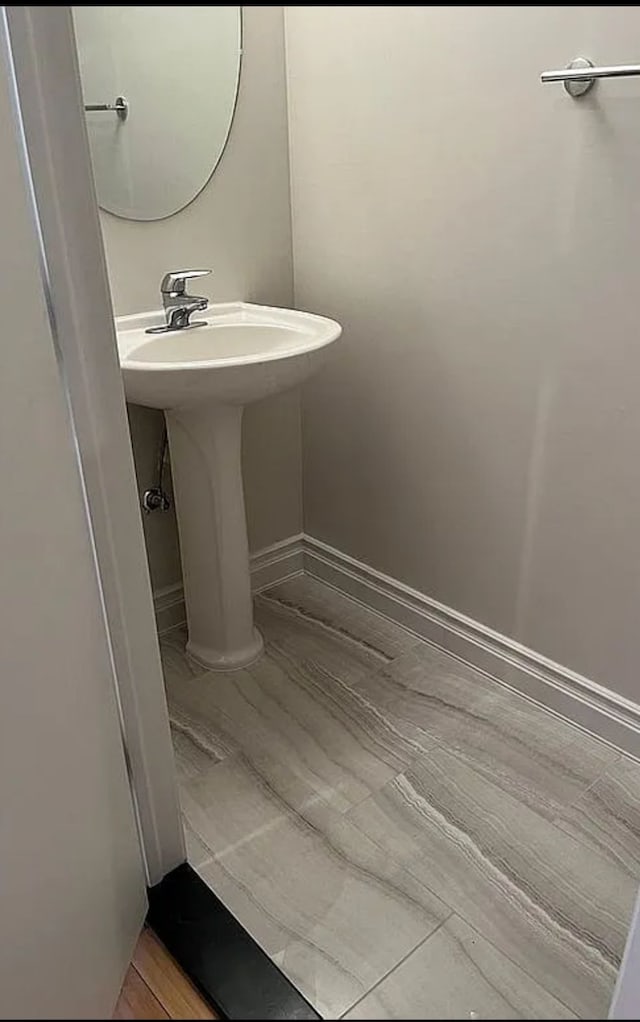 bathroom with wood-type flooring