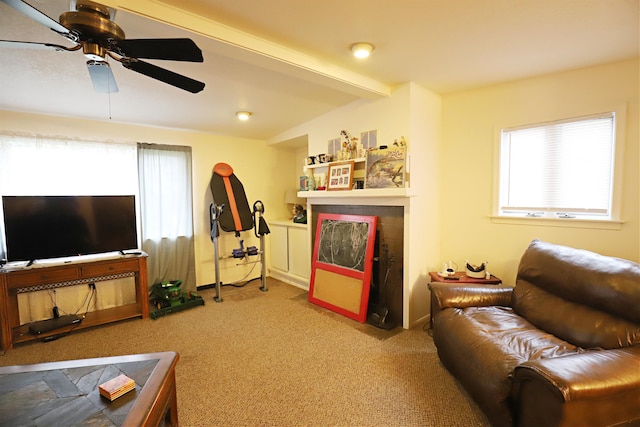 carpeted living room with ceiling fan