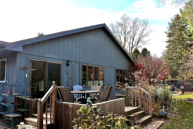 back of property with a wooden deck