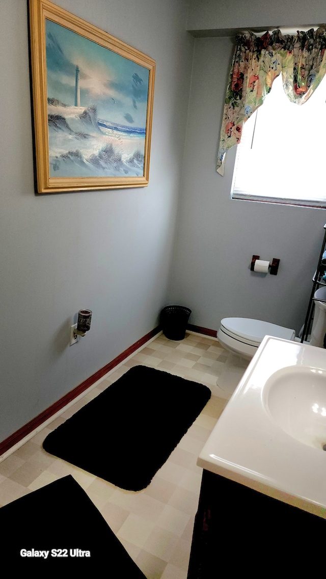 bathroom with vanity and toilet