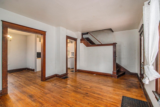 unfurnished room featuring hardwood / wood-style flooring