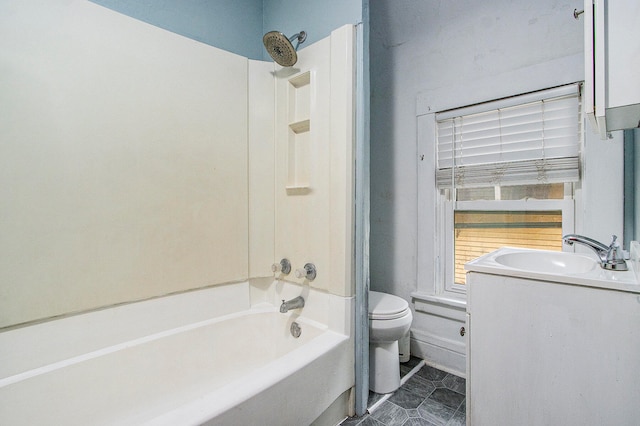 full bathroom featuring vanity, bathtub / shower combination, and toilet